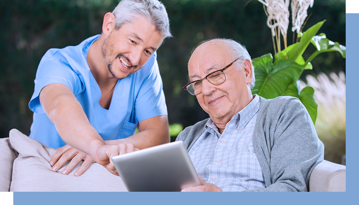 Elderly man looking over assessment results with son on tablet, saving time and money