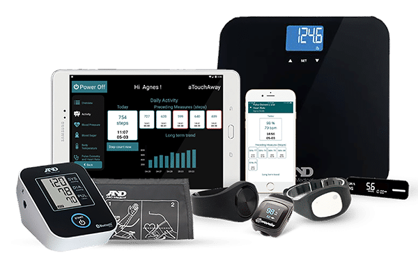 Group of health monitoring devices, like a digital scale, watches, blood pressure machine and a tablet and smartphone with the aTouchAway application opened