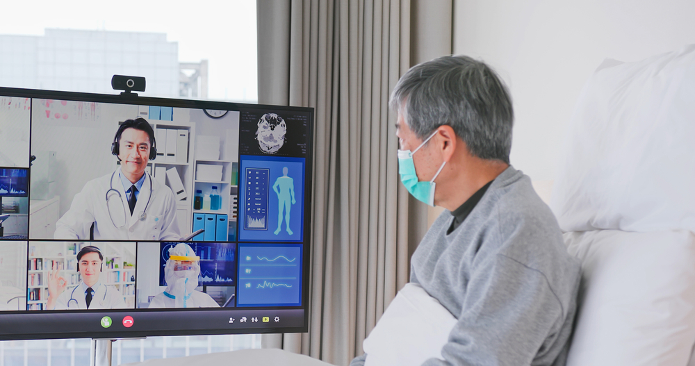 Telemedicine,Concept,-,Asian,Senior,Man,Patient,Lying,On,Bed